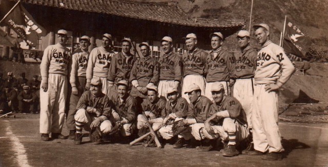 A North Korean "baseball team" propaganda photo of American POWs. The picture was sent to the Communist Party of America. Jack is on far right, standing.