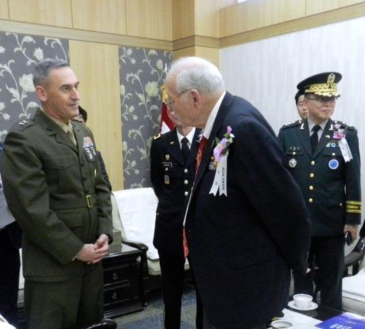 Major General James W. Lukeman, Commander of US Marine Corps Forces Korea, with Jean White, Chosin veteran