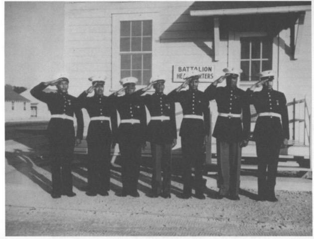 Montford Point Marines proudly saluting in their dress uniforms, circa 1943.