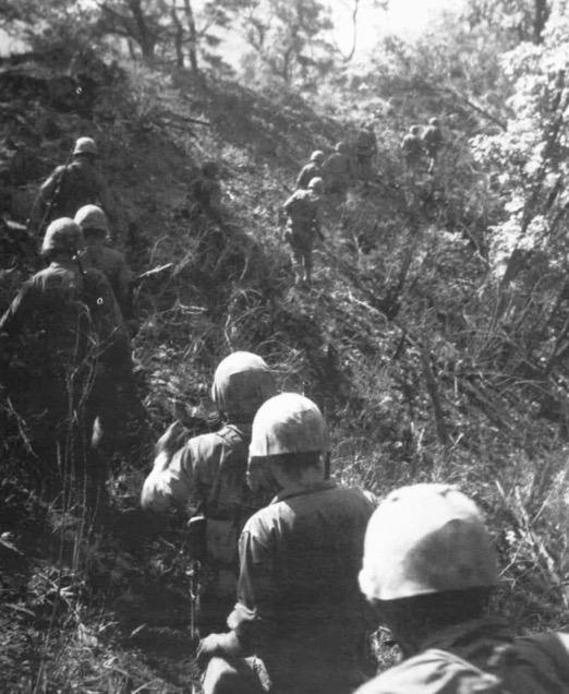 A Marine rifle platoon moves toward the enemy. June, 1952.