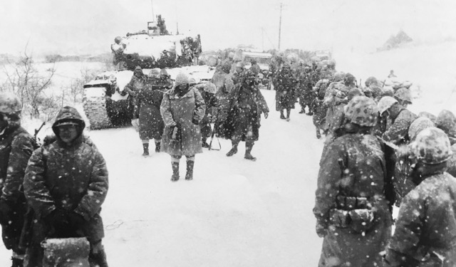 Marines begin the long, cold trek to Hungnam; many would not survive.