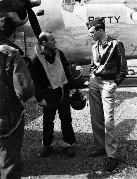 Maj. Jimmy Stewart confers with a B-24 crew member. (PC: U.S. Air Force)