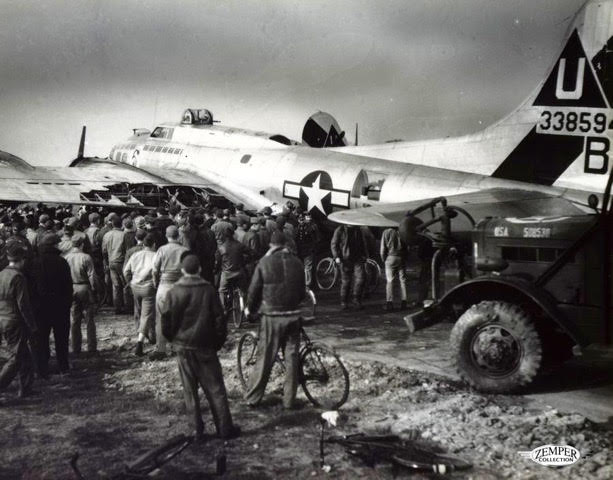 Ground personnel look at the damaged wing flap section of the "Lady B Good." The B-17 later made a crash landing in Belgium. The crew was unharmed and returned to Glatton to finish their WWII service. (PC: Zemper Collection, http://www.457thbombgroup.org)