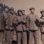 Lt. Funchess (second from right), with fellow prisoners, in a staged propaganda photo. (PC: Frank Noel)